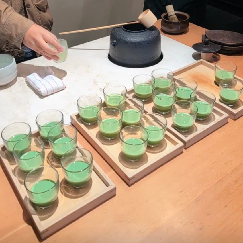 Creamy matcha latte in a glass cup