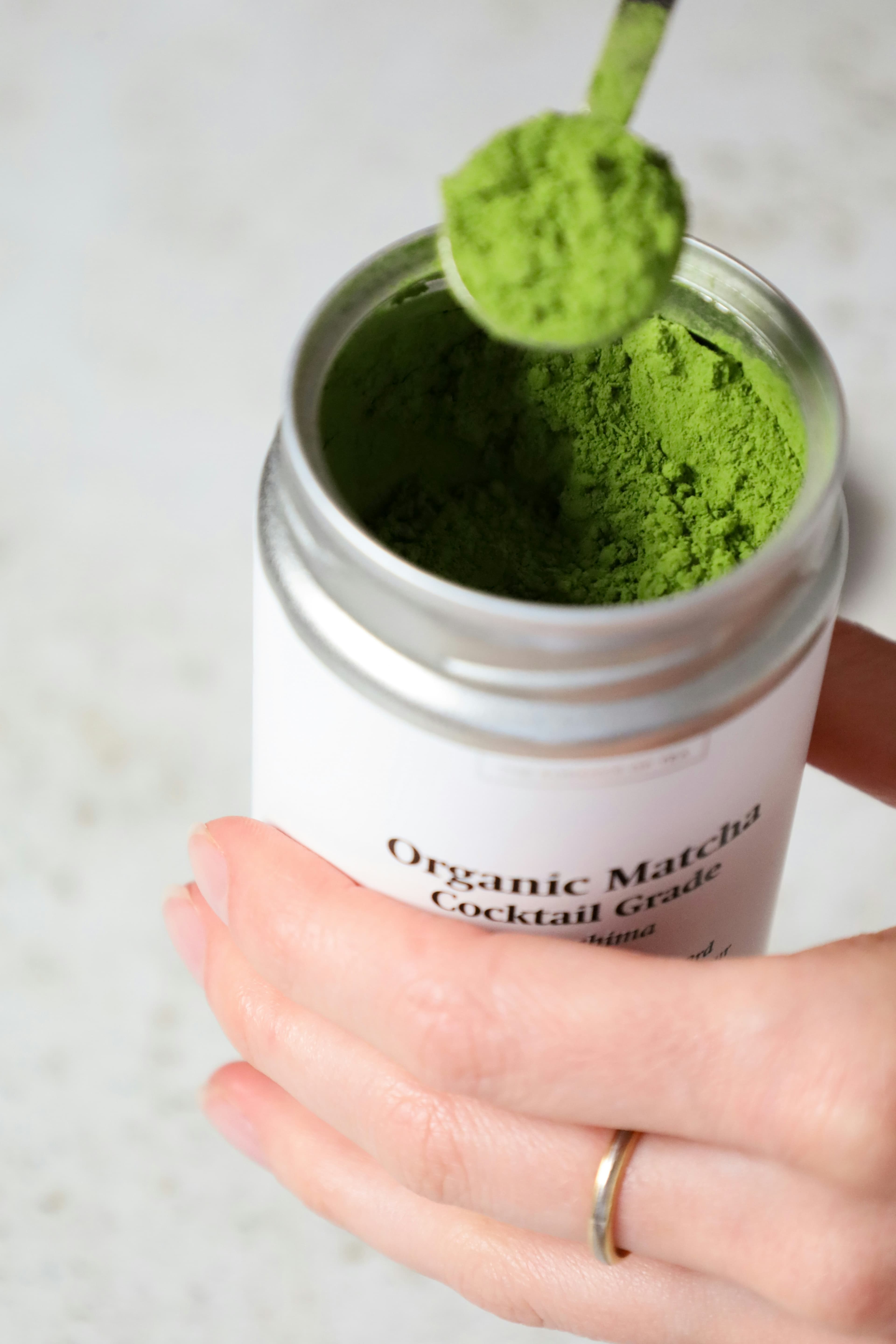 Matcha powder being sifted into a bowl